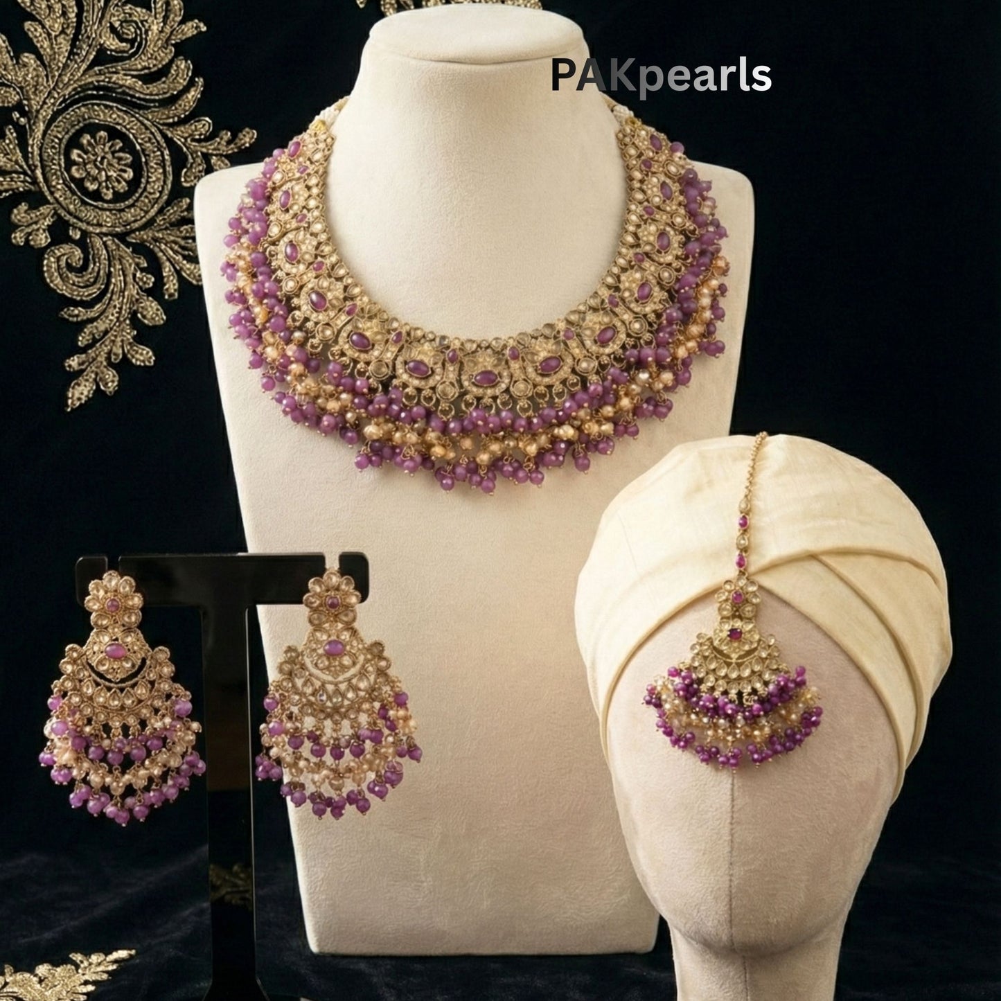 Pair of Sanaya Polki Earrings in a traditional heavy drop style, featuring gold latticework and purple gemstone beads matching the bridal necklace set.
