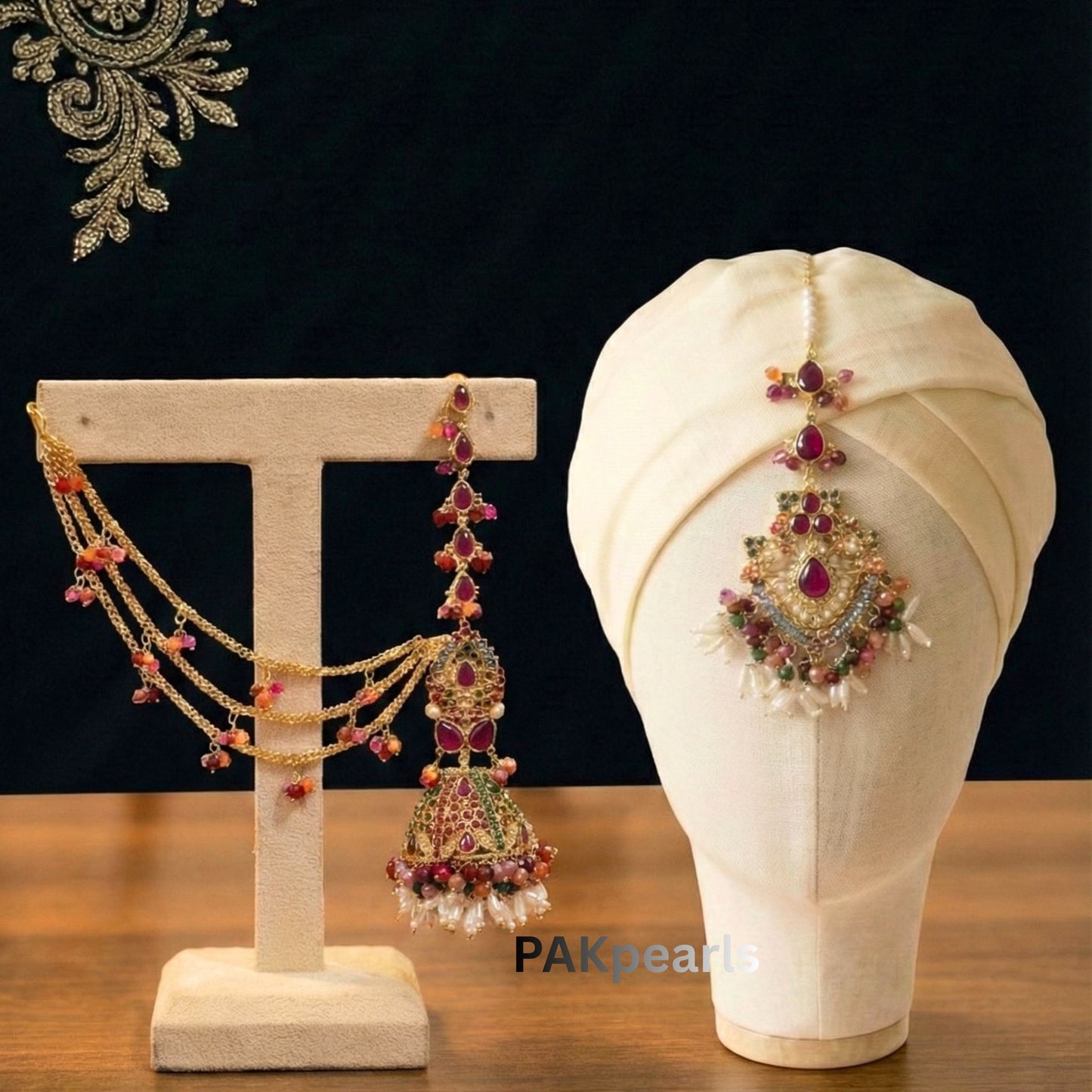 Close up of Gold Plated Jhumka Earrings featuring Multi-color Nauratan Stones and Pearl Drops