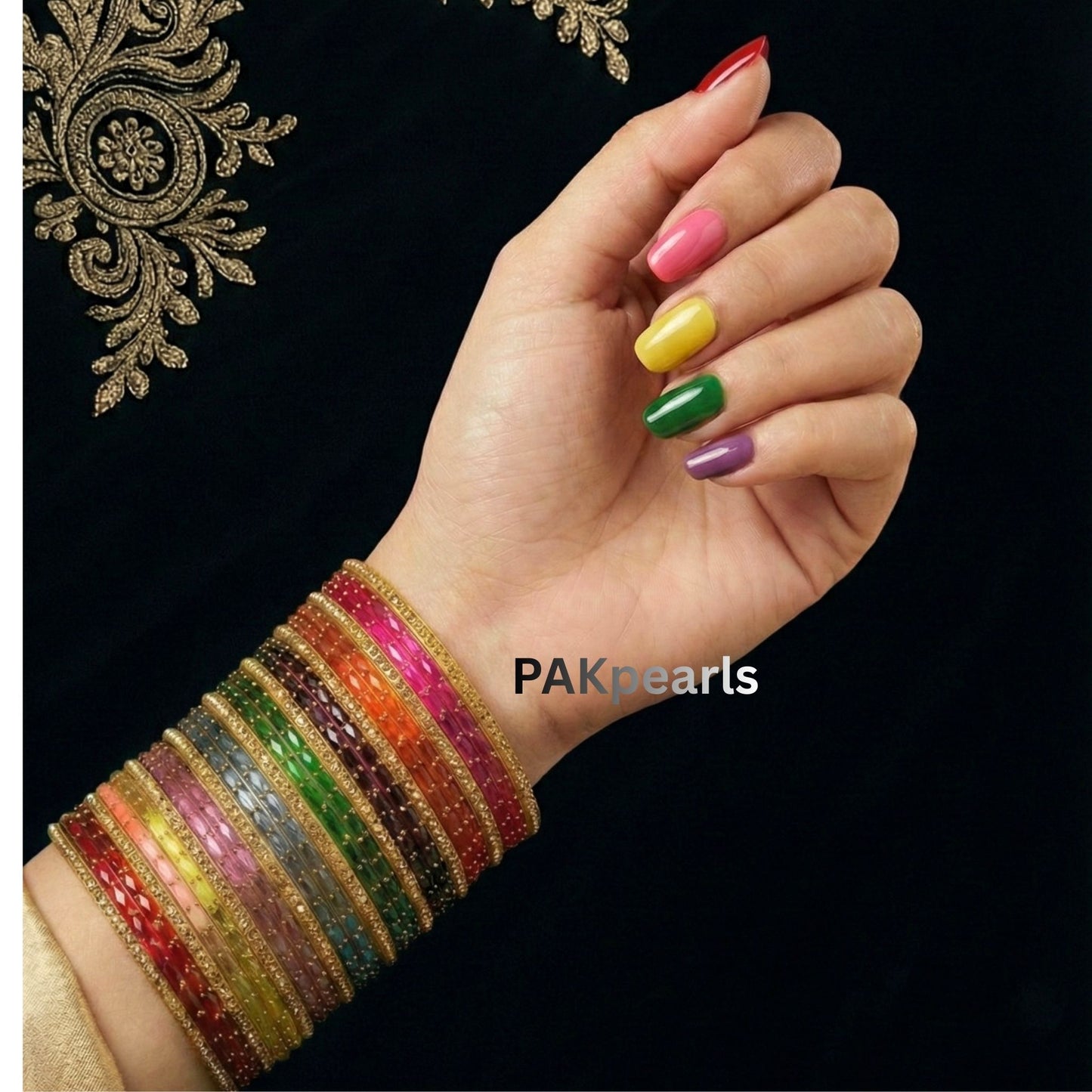 A full stack of 26 traditional Indian glass bangles in assorted colors displayed on a white stand, ideal for bridal or festive ethnic wear.