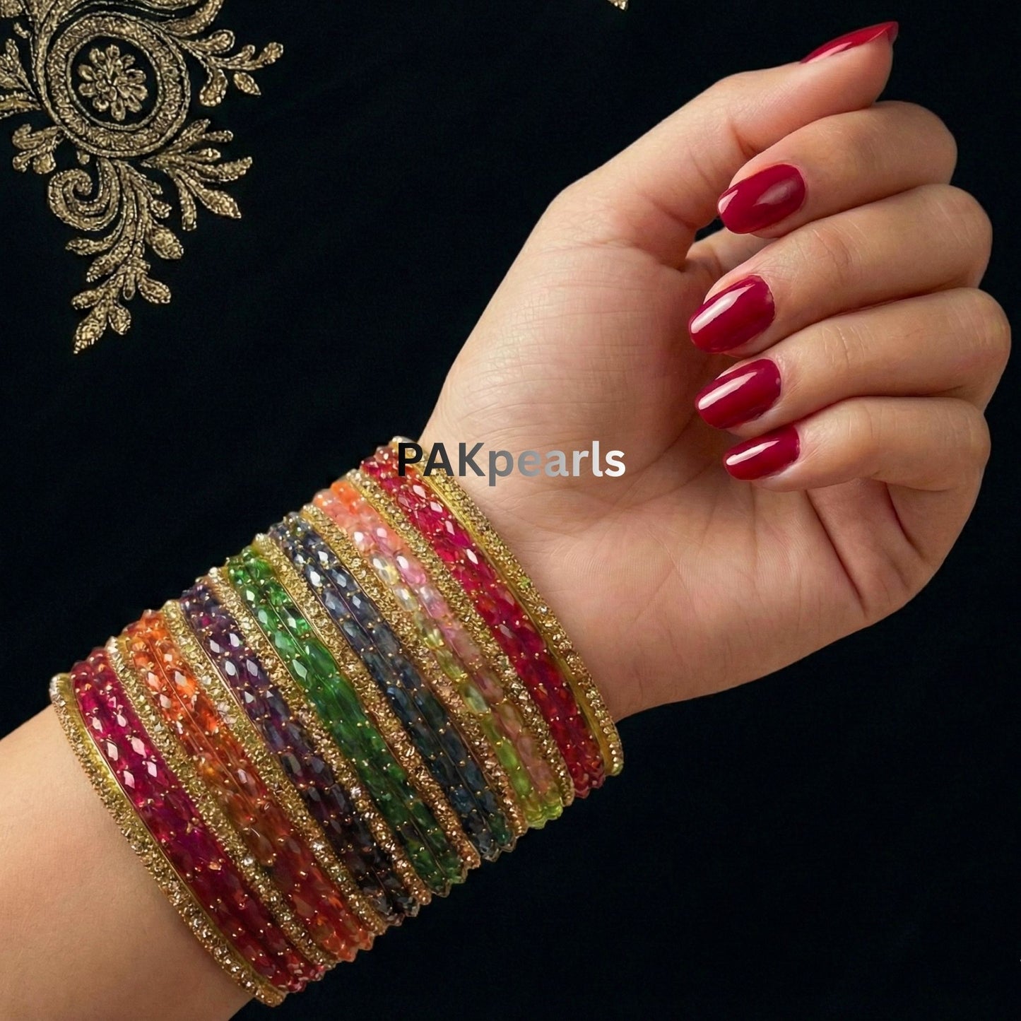 Multi-color Indian Raindrop glass bangle set of 26 pieces featuring vibrant faceted glass and gold-toned stone-encrusted borders by PAKpearls.