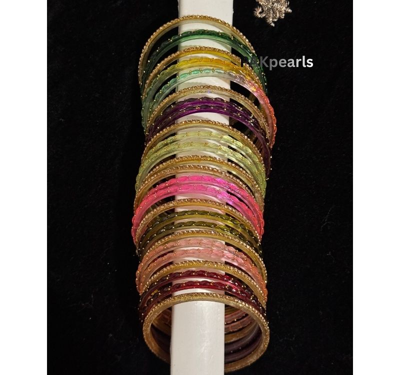 ide profile of faceted glass bangle set showing the intricate gold stone work and the variety of sizes available (2.4, 2.6, 2.8).